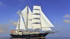 Sailing yacht RUNNING ON WAVES
